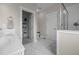 Light bathroom features large vanity, tile floors, and door to toilet and walk-in shower at 31 Sweet Birch Ave, Zebulon, NC 27597