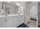 Bathroom features dual sinks, generous cabinet space, and a door to the toilet and shower area at 31 Sweet Birch Ave, Zebulon, NC 27597