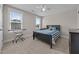 Comfortable bedroom with carpet, a queen bed and plenty of natural light from two windows at 31 Sweet Birch Ave, Zebulon, NC 27597