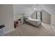 Cozy bedroom features neutral decor, a ceiling fan, and ample natural light at 31 Sweet Birch Ave, Zebulon, NC 27597