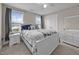 Charming bedroom features a queen sized bed, neutral paint, carpet and lots of light at 31 Sweet Birch Ave, Zebulon, NC 27597