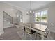 Bright dining room with hardwood floors and a decorative chandelier over a dining table at 31 Sweet Birch Ave, Zebulon, NC 27597