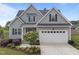 Charming gray two-story home with a two-car garage, landscaped yard, and inviting front entrance at 31 Sweet Birch Ave, Zebulon, NC 27597