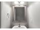 The bathroom features a modern sink, mirror and lighting at 3100 Berkeley Springs Pl, Raleigh, NC 27616