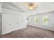 This bedroom features a ceiling fan, a large closet, and natural light at 3100 Berkeley Springs Pl, Raleigh, NC 27616