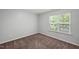 Cozy bedroom with neutral carpeting and a bright window at 3100 Berkeley Springs Pl, Raleigh, NC 27616