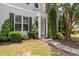View of the front of the home with lush landscaping and a well-manicured lawn at 3100 Berkeley Springs Pl, Raleigh, NC 27616