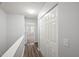 Hallway with closet leads to a carpeted room with natural light at 3100 Berkeley Springs Pl, Raleigh, NC 27616