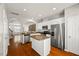 Bright kitchen features stainless appliances, a center island, and an open layout at 3100 Berkeley Springs Pl, Raleigh, NC 27616
