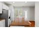 Bright kitchen featuring stainless appliances and granite countertops, with an adjacent eating area at 3100 Berkeley Springs Pl, Raleigh, NC 27616