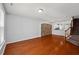 Spacious living room featuring hardwood floors, neutral walls, and a stone accent wall at 3100 Berkeley Springs Pl, Raleigh, NC 27616