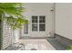 Back patio with tropical landscaping and privacy at 3100 Berkeley Springs Pl, Raleigh, NC 27616