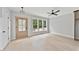 Bright bedroom with light wood floors, neutral paint, and a modern ceiling fan at 317 W Murray Ave, Durham, NC 27704
