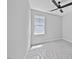 An empty bedroom with a ceiling fan and one window at 317 W Murray Ave, Durham, NC 27704