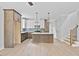 Modern kitchen featuring a center island, stylish pendant lighting, and stainless steel appliances at 317 W Murray Ave, Durham, NC 27704