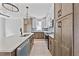 Modern kitchen featuring stainless steel appliances, light countertops, and custom cabinets at 317 W Murray Ave, Durham, NC 27704
