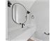 Powder room with white vanity, quartz countertop and dark plumbing fixtures at 317 W Murray Ave, Durham, NC 27704
