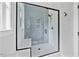 A modern glass shower featuring white subway tile and a built-in seat at 317 W Murray Ave, Durham, NC 27704