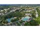 Community aerial view showcasing neighborhood homes, trees, pool and tennis courts at 3311 Canoe Brook Pkwy, Raleigh, NC 27614
