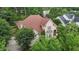 Aerial view of a brick home nestled among lush trees in a desirable neighborhood at 3311 Canoe Brook Pkwy, Raleigh, NC 27614