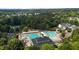 Aerial view of community pool with swim lanes, splash pad, and play area at 3311 Canoe Brook Pkwy, Raleigh, NC 27614