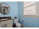 Cozy powder room with granite countertops, modern fixtures, and natural lighting at 3311 Canoe Brook Pkwy, Raleigh, NC 27614