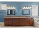 Bathroom with double vanities and granite countertops, plus decorative lighting at 3311 Canoe Brook Pkwy, Raleigh, NC 27614