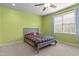 Cozy bedroom featuring a ceiling fan, window, and comfortable bed at 3311 Canoe Brook Pkwy, Raleigh, NC 27614