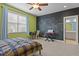 Bedroom featuring chalkboard wall, ceiling fan, and ensuite bathroom at 3311 Canoe Brook Pkwy, Raleigh, NC 27614