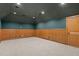 Spacious bonus room with neutral carpet, wainscoting, and recessed lighting at 3311 Canoe Brook Pkwy, Raleigh, NC 27614