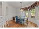 Charming dining room with colorful chairs, hardwood floor, and natural light at 3311 Canoe Brook Pkwy, Raleigh, NC 27614