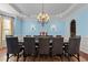 Elegant dining room with hardwood floors, chandelier, and wainscoting at 3311 Canoe Brook Pkwy, Raleigh, NC 27614