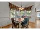 Bright dining room featuring colorful chairs, hardwood floor, and natural light at 3311 Canoe Brook Pkwy, Raleigh, NC 27614