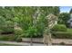 Charming brick home with lush landscaping, stone accents, and a welcoming entrance at 3311 Canoe Brook Pkwy, Raleigh, NC 27614