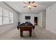 Spacious game room with a pool table and a ceiling fan at 3311 Canoe Brook Pkwy, Raleigh, NC 27614