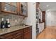 Gourmet kitchen featuring custom cabinetry, granite counters, and stainless steel appliances at 3311 Canoe Brook Pkwy, Raleigh, NC 27614