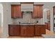 Gourmet kitchen boasts custom cabinetry, granite countertops, and modern appliances at 3311 Canoe Brook Pkwy, Raleigh, NC 27614