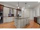 Kitchen island features granite counters and stainless steel appliances at 3311 Canoe Brook Pkwy, Raleigh, NC 27614