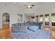 Sun-filled living area with hardwood flooring, large windows, and comfortable seating at 3311 Canoe Brook Pkwy, Raleigh, NC 27614