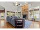 Spacious living room with a stone fireplace, vaulted ceilings, and hardwood floors at 3311 Canoe Brook Pkwy, Raleigh, NC 27614
