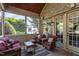 Cozy screened porch with comfortable seating and views of the surrounding landscape at 3311 Canoe Brook Pkwy, Raleigh, NC 27614