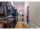 Walk-in closet featuring a mirror, shelving and hanging racks at 3311 Canoe Brook Pkwy, Raleigh, NC 27614