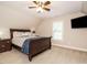 Bedroom with a wooden bed frame, carpet flooring, and a ceiling fan at 334 Dell Meadows Pl, Four Oaks, NC 27524