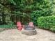 Outdoor fire pit area with comfortable seating, great for entertaining and relaxation at 334 Dell Meadows Pl, Four Oaks, NC 27524
