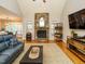 Inviting living room with a stone fireplace, hardwood floors, and ample natural light at 334 Dell Meadows Pl, Four Oaks, NC 27524