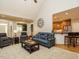 Spacious living room open to the kitchen, featuring a vaulted ceiling and hardwood floors at 334 Dell Meadows Pl, Four Oaks, NC 27524