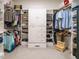 Spacious walk-in closet featuring ample shelving, built-in drawers, and hanging space for optimal storage at 334 Dell Meadows Pl, Four Oaks, NC 27524
