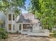 Two-story home exterior with a white deck and lush landscaping at 3811 Carnegie Ln, Raleigh, NC 27612