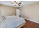Bedroom with a ceiling fan, natural light, hardwood floors, and neutral colored walls at 3811 Carnegie Ln, Raleigh, NC 27612