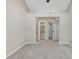 Spacious bedroom with neutral paint and multiple doors at 3811 Carnegie Ln, Raleigh, NC 27612